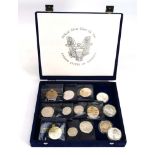 A cased containing fourteen silver and collectable American coins (14)