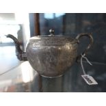 A Chinese Export pewter teapot stamped Huikee Swatow