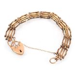 A 9ct yellow gold four bar gatelink bracelet with heart shaped padlock clasp, 13.6 gms