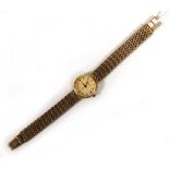 A ladies 9ct yellow gold wristwatch by Rotary, the circular dial with baton numerals on an