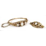 A 19th century style 9ct yellow gold hinged bracelet and a matching brooch, each set opals and