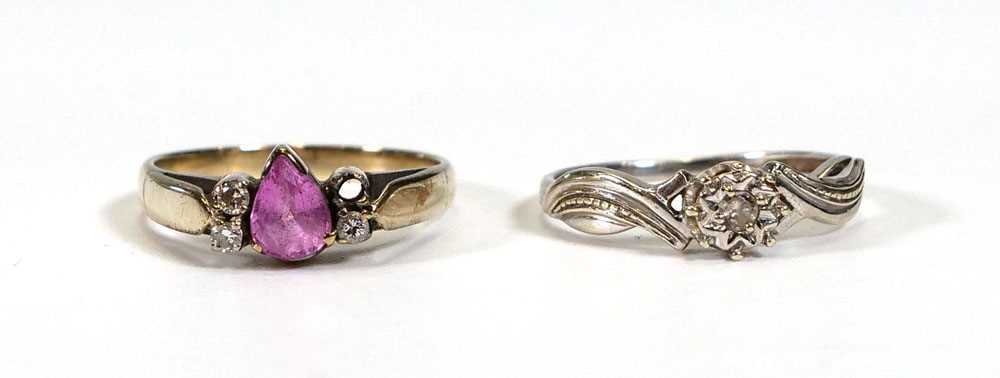 A yellow metal ring set teardrop (?)pink sapphire and three small diamonds, ring size M 1/2 and a