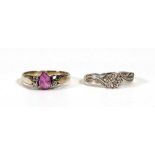 A yellow metal ring set teardrop (?)pink sapphire and three small diamonds, ring size M 1/2 and a
