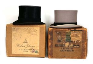 Herbert Johnson: two silk top hats in grey and black, both in the original card boxes (2)Black hat