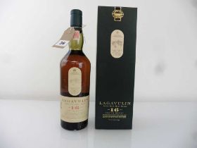 An old bottle of Lagavulin 16 year old Single Islay Malt Scotch Whisky by White Horse Distillers