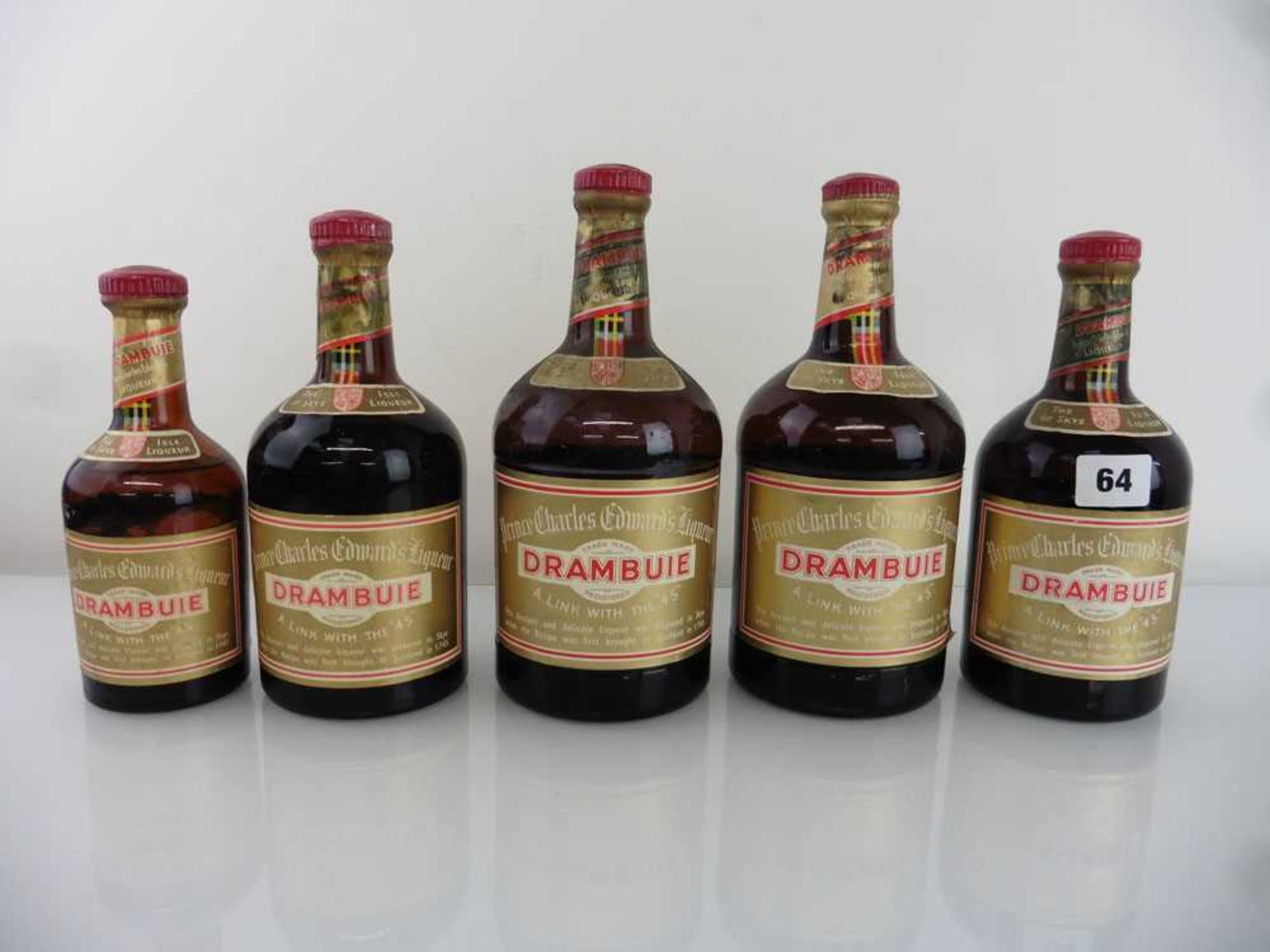 5 various old bottles of Drambuie Isle of Skye Liqueur, 1x 70 proof 23 3/4 fl oz, 1x 70 proof 11 5/6