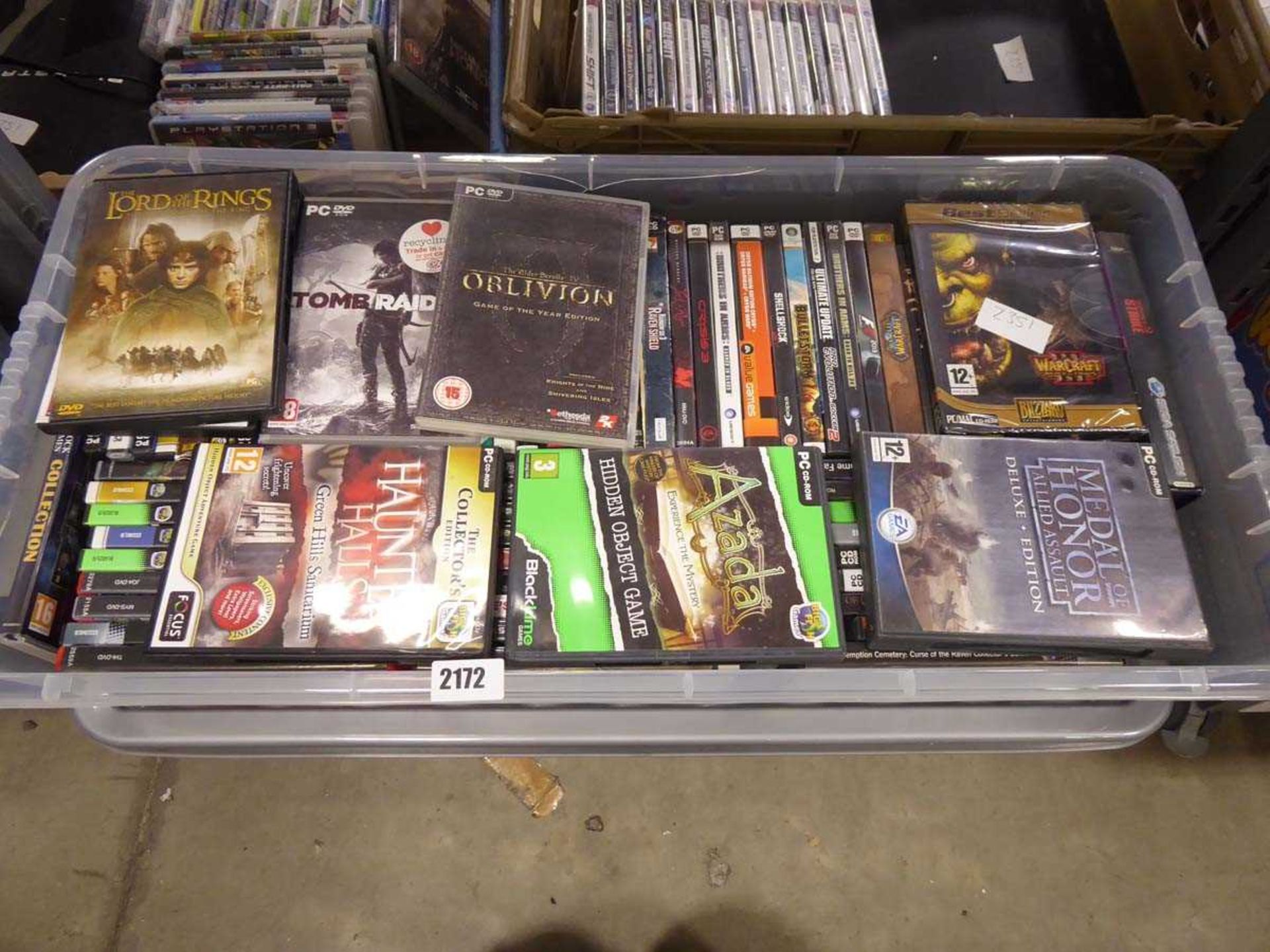 Box containing large selection of PC and DVD games