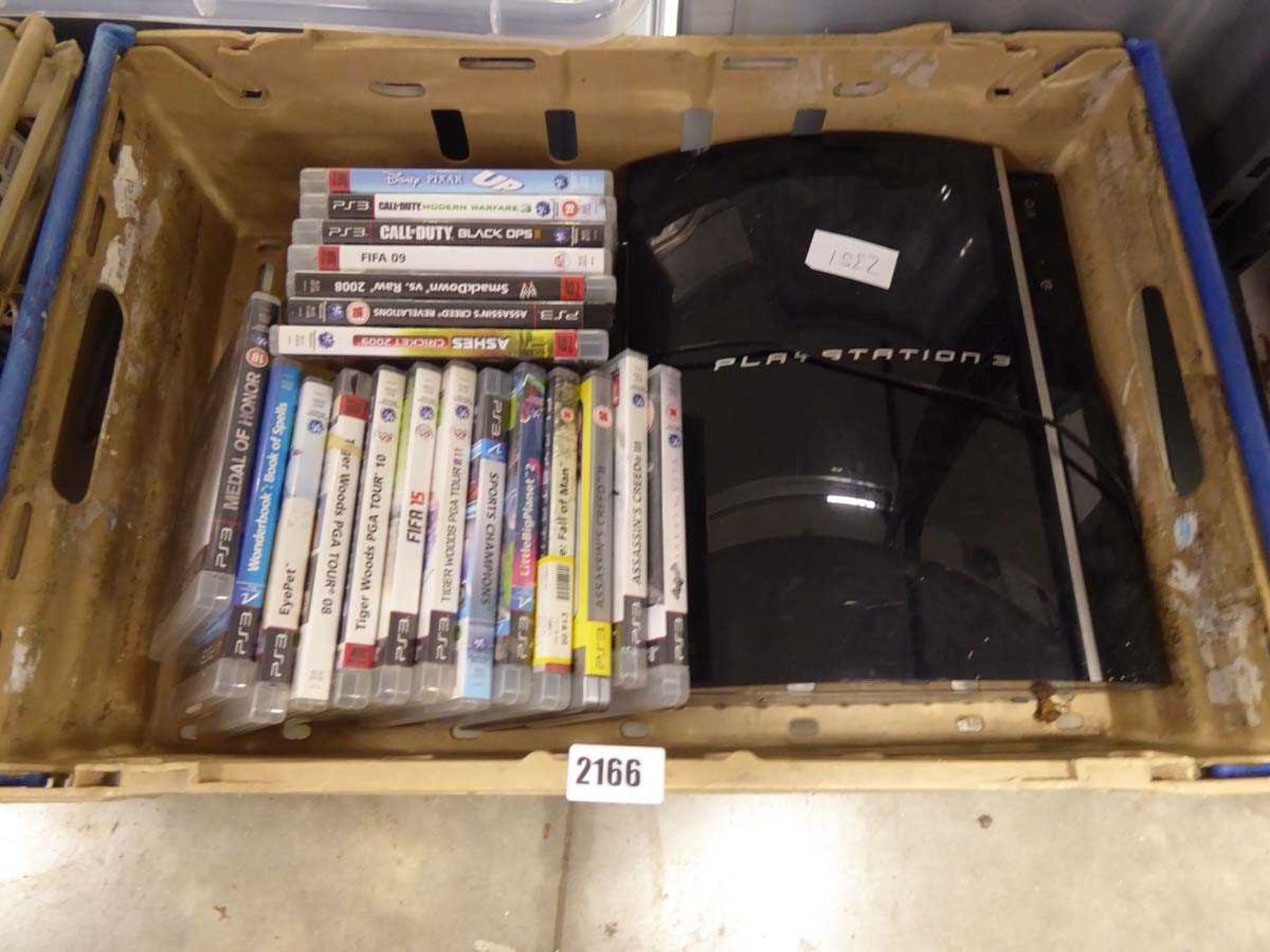 PS3 console with games and controller