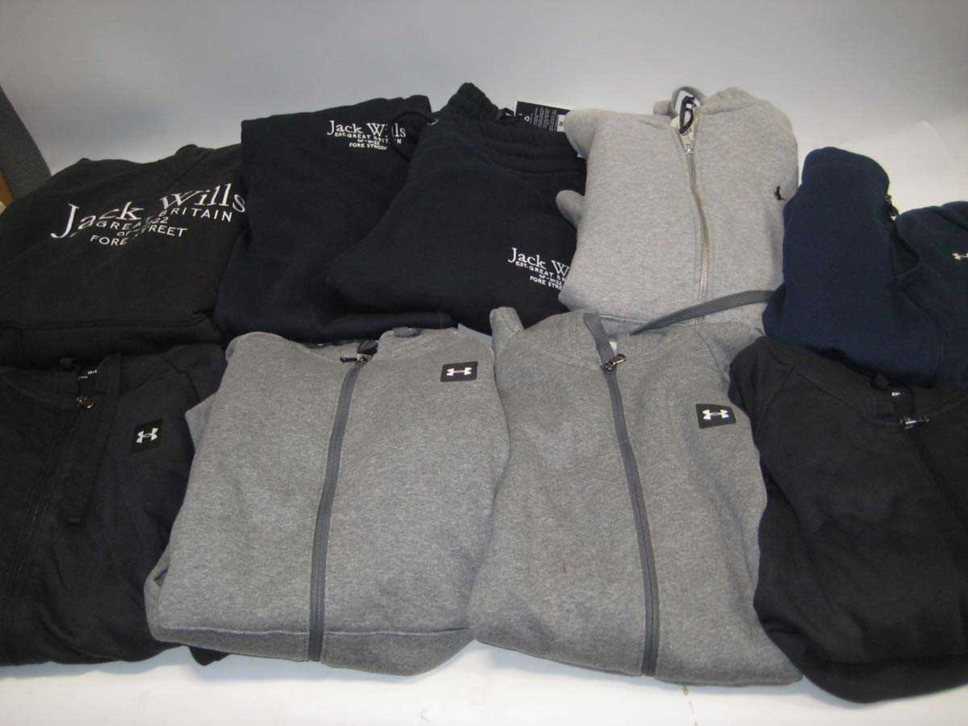 +VAT A bag containing Under Armour Hoodies and Jack Wills Hoodies and Joggers in various sizes and