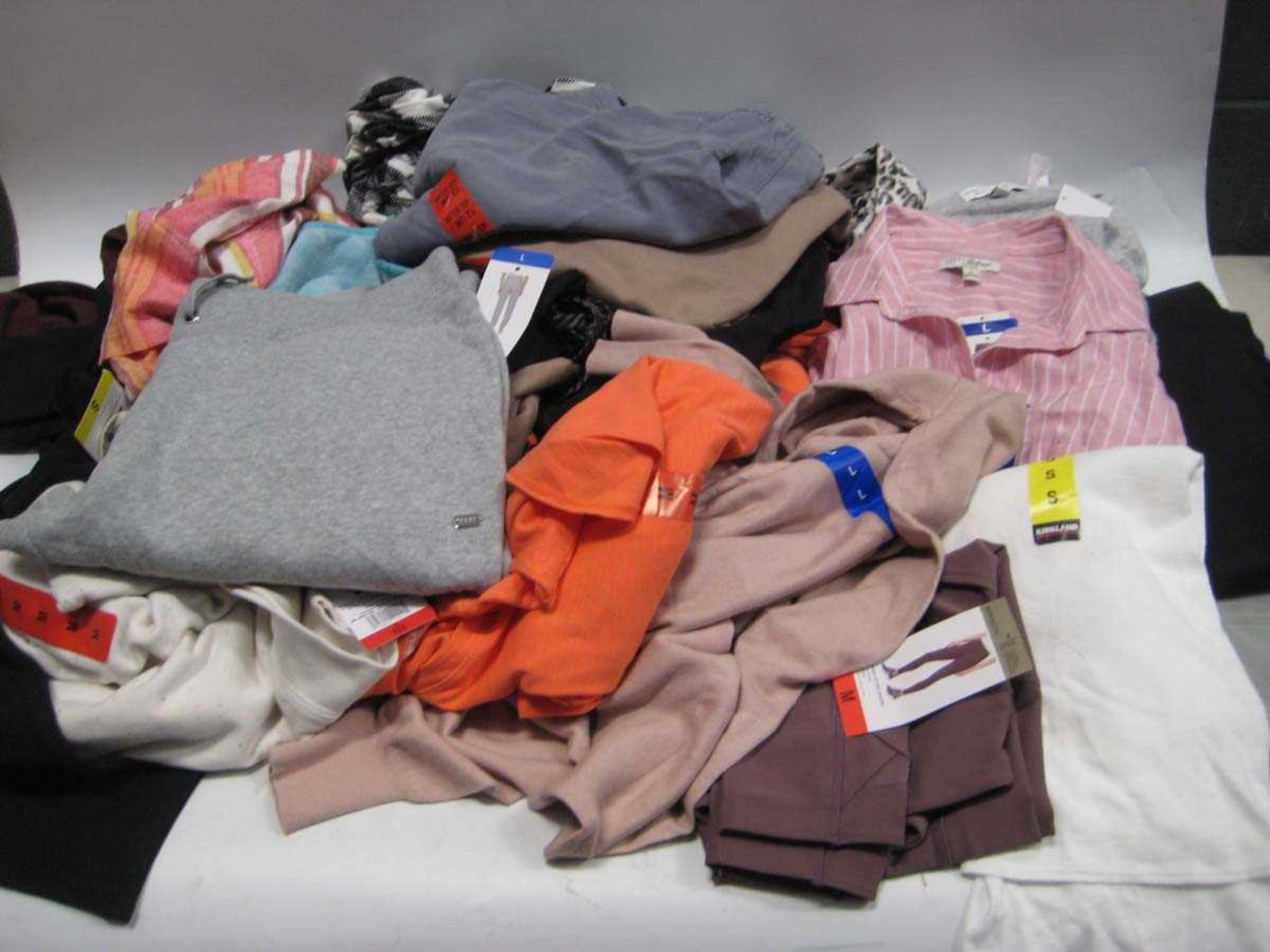 +VAT A bag containing Ladies Clothing in various styles and sizes