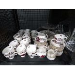 Cage containing a quantity of rose patterned Colclough crockery and glassware