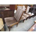 Four upholstered teak dining chairs