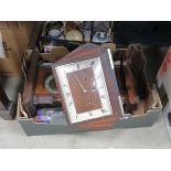 Box containing a quantity of wall and mantle clocks