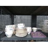 Cage containing Royal Stafford and other crockery plus glassware and metal card holders