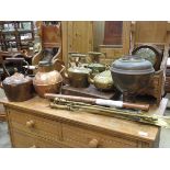 Quantity of copper and brassware to include kettles, jugs, fire companion set, trays plus two