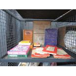 Cage containing ordnance survey maps, jigsaw puzzles and games