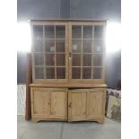 Double door glazed bookcase with cupboard base under