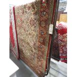 (23) Floral carpet with red border and ivory background