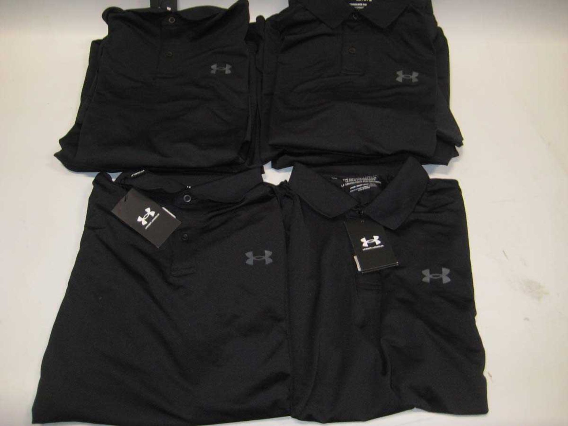 +VAT A bag containing 8x Men's Black Under Armour Polo T Shirts in various sizes.