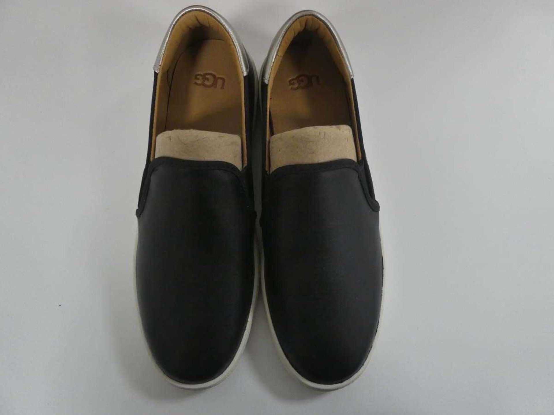 +VAT Boxed pair of UGG slip on shoes in black / silver size UK5 - Image 2 of 4