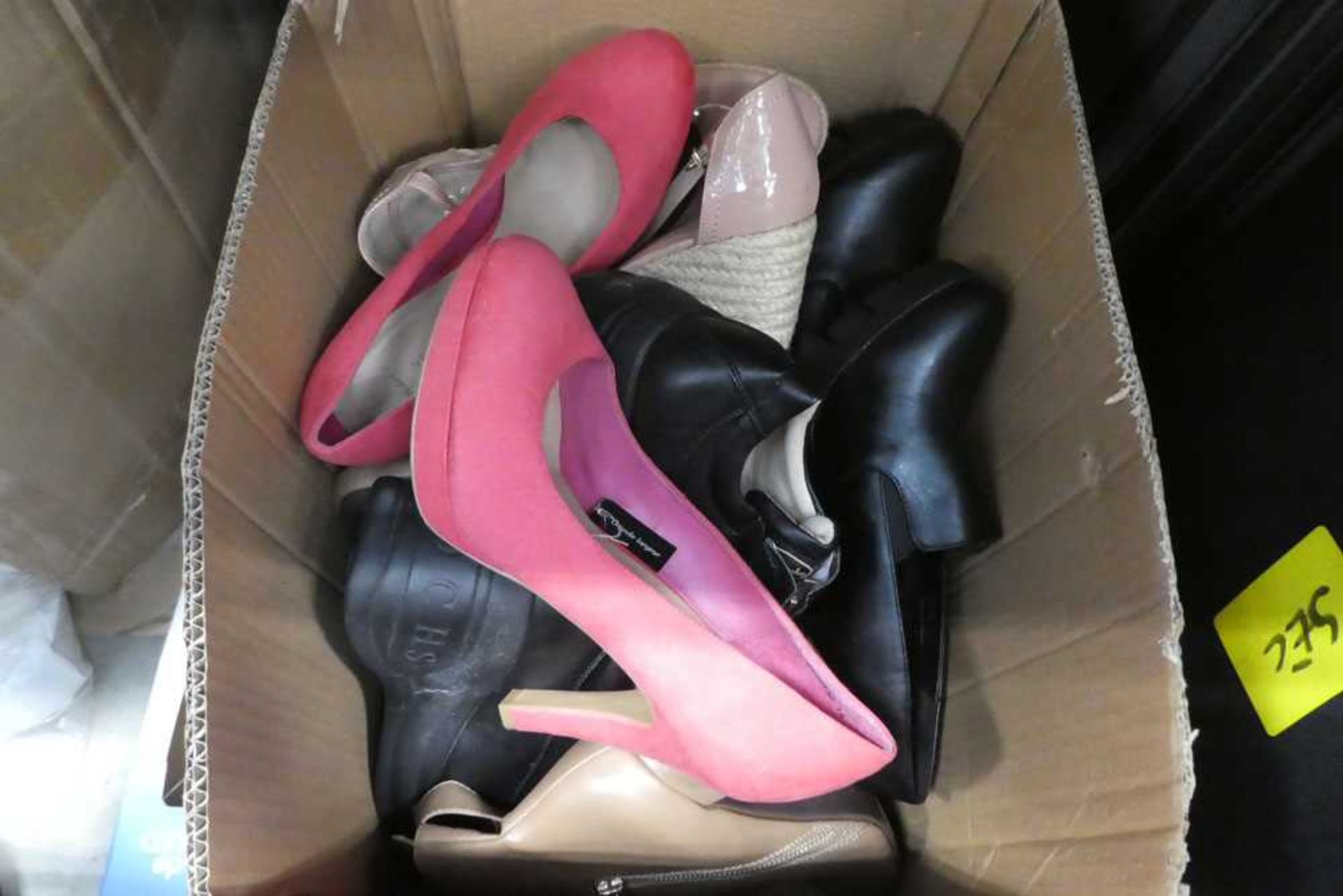 Box of mixed men and women's shoes