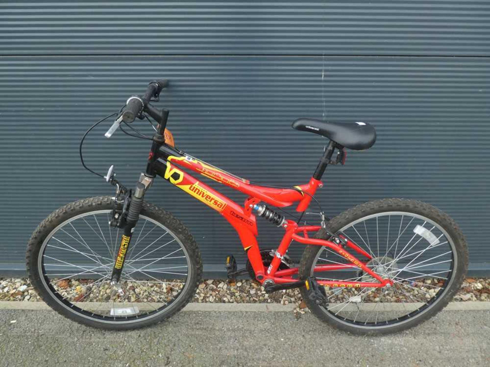 Team Universal full suspension mountain bike in red and yellow