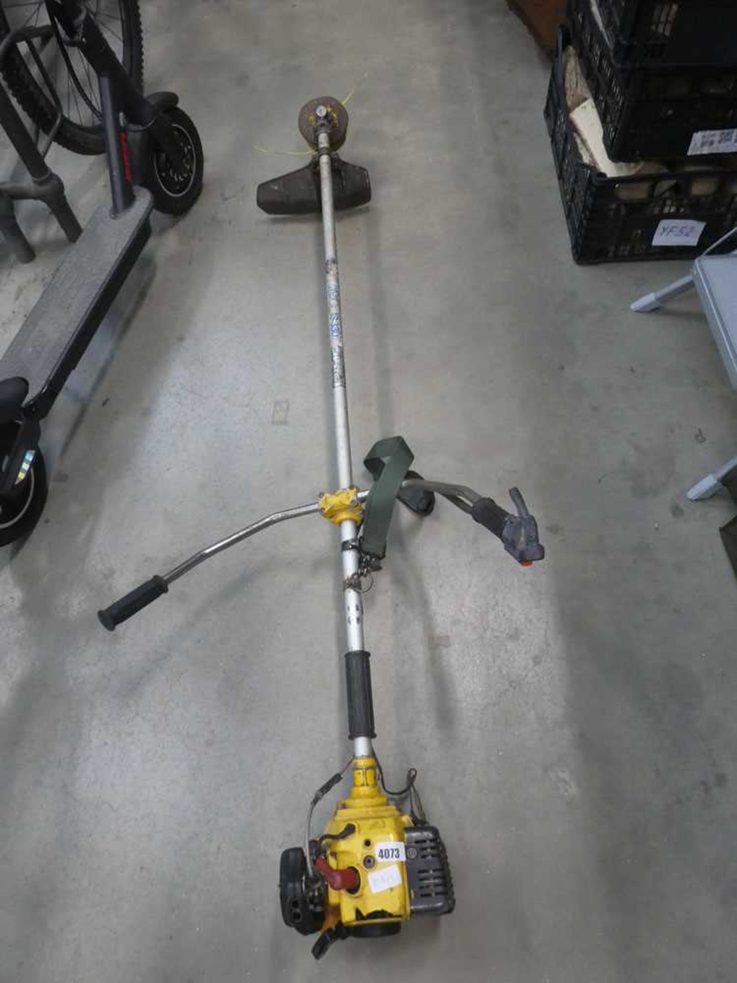 Kawasaki straight shaft petrol powered strimmer