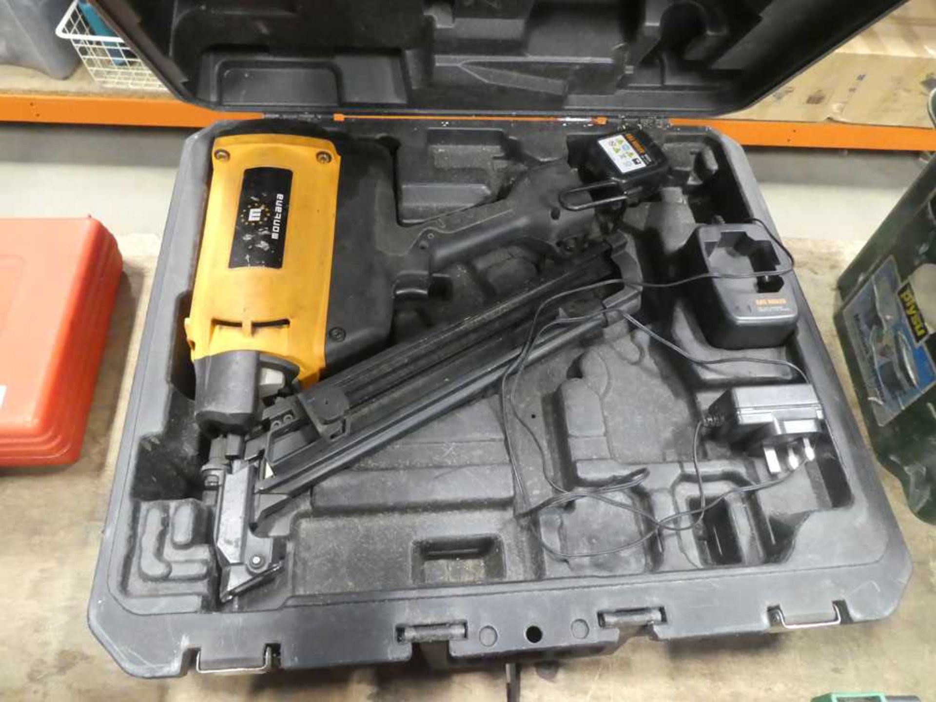 Cased Montana cordless nail gun with a battery and charger
