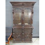 Gothic style bookcase with glazed and leathered doors with cupboard base under