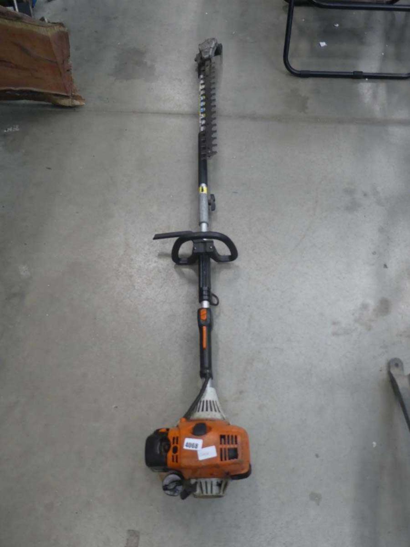 Long reach Stihl hedge cutter with attachment