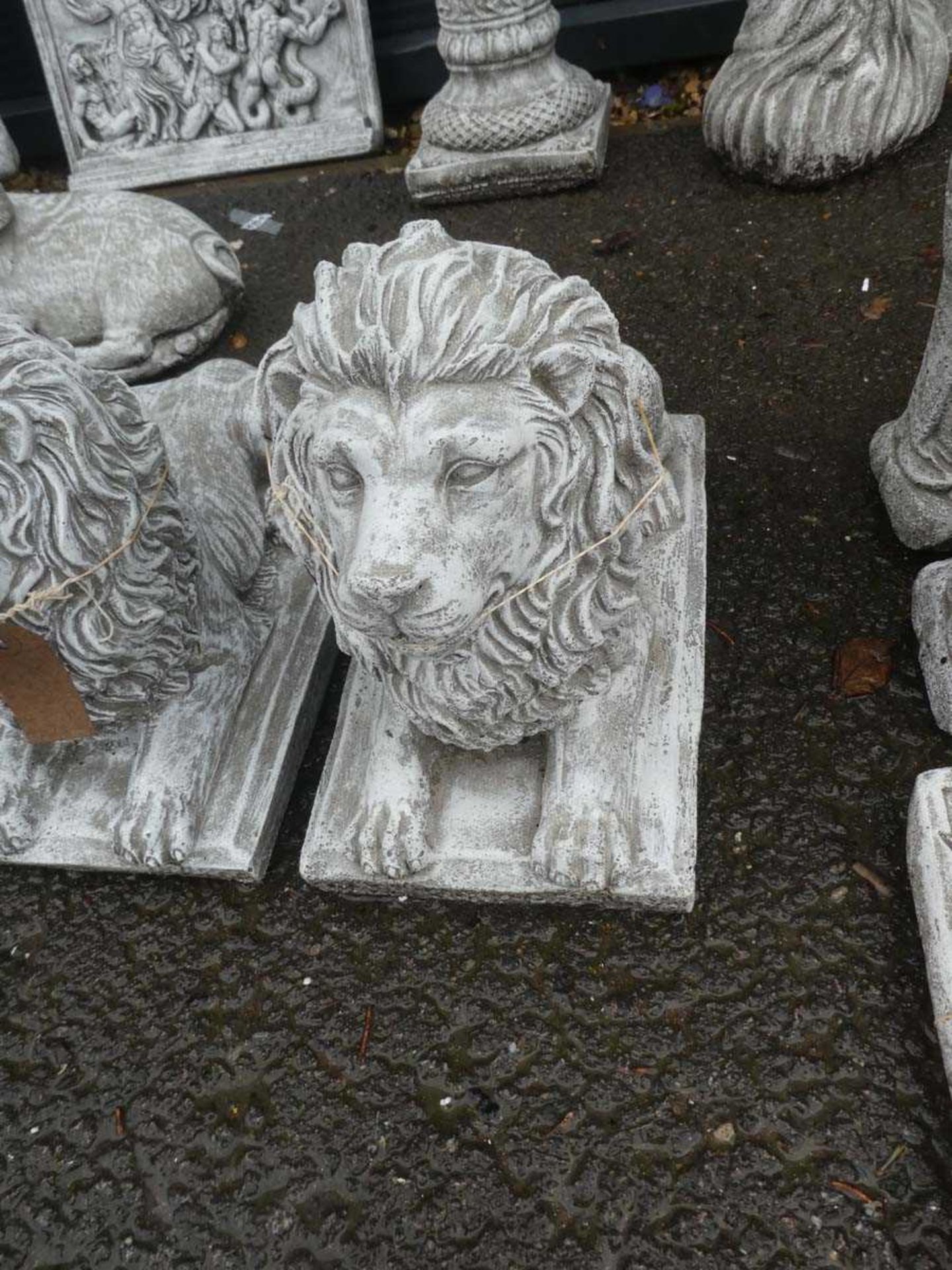 Concrete figure of a prone lion