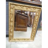 Rectangular bevelled mirror in gilt frame