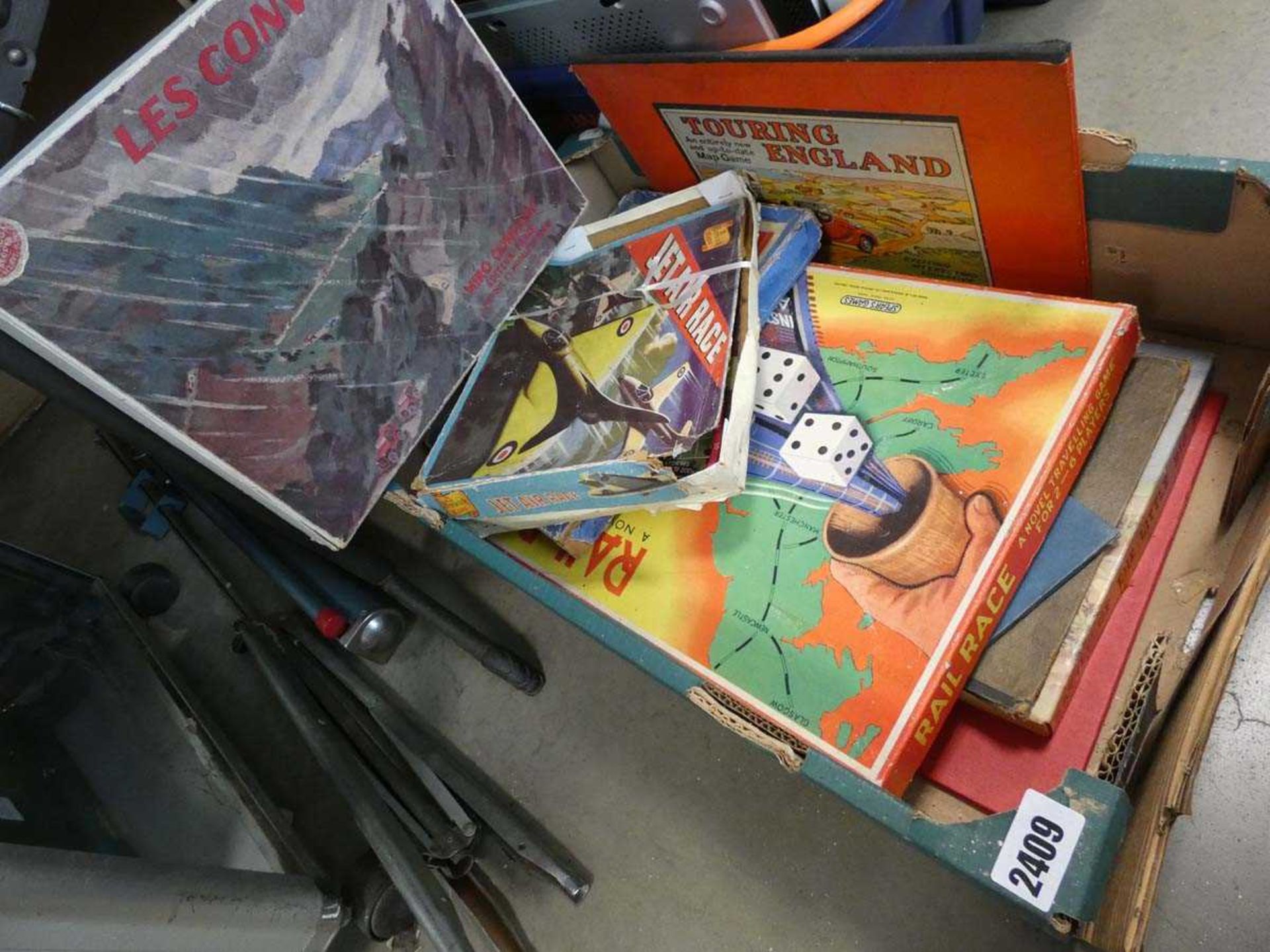 Cardboard tray containing various vintage board games