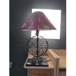 Wrought iron table lamp with maroon fabric shade