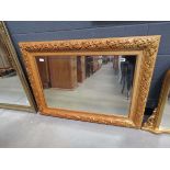 Rectangular bevelled mirror in floral gilt frame