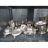 Cage containing silver plate to include hot water jug, butter dish, wine cooler, trays, sugar bowl