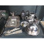 Cage containing silver-plated tea service, bon bon dish, butter dish and loose cutlery