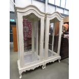 2 cream painted and mirrored display cabinets