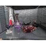 Cage containing glass vases and dishes