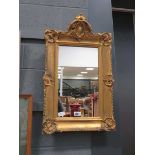 Rectangular mirror in ornate gilt frame