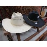 Two modern cowboy style hats