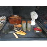 Cage containing tea caddy, rests, ornamental boots, dish, military badges, shell shaped vase