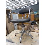 Chromed and leather effect swivel armchair