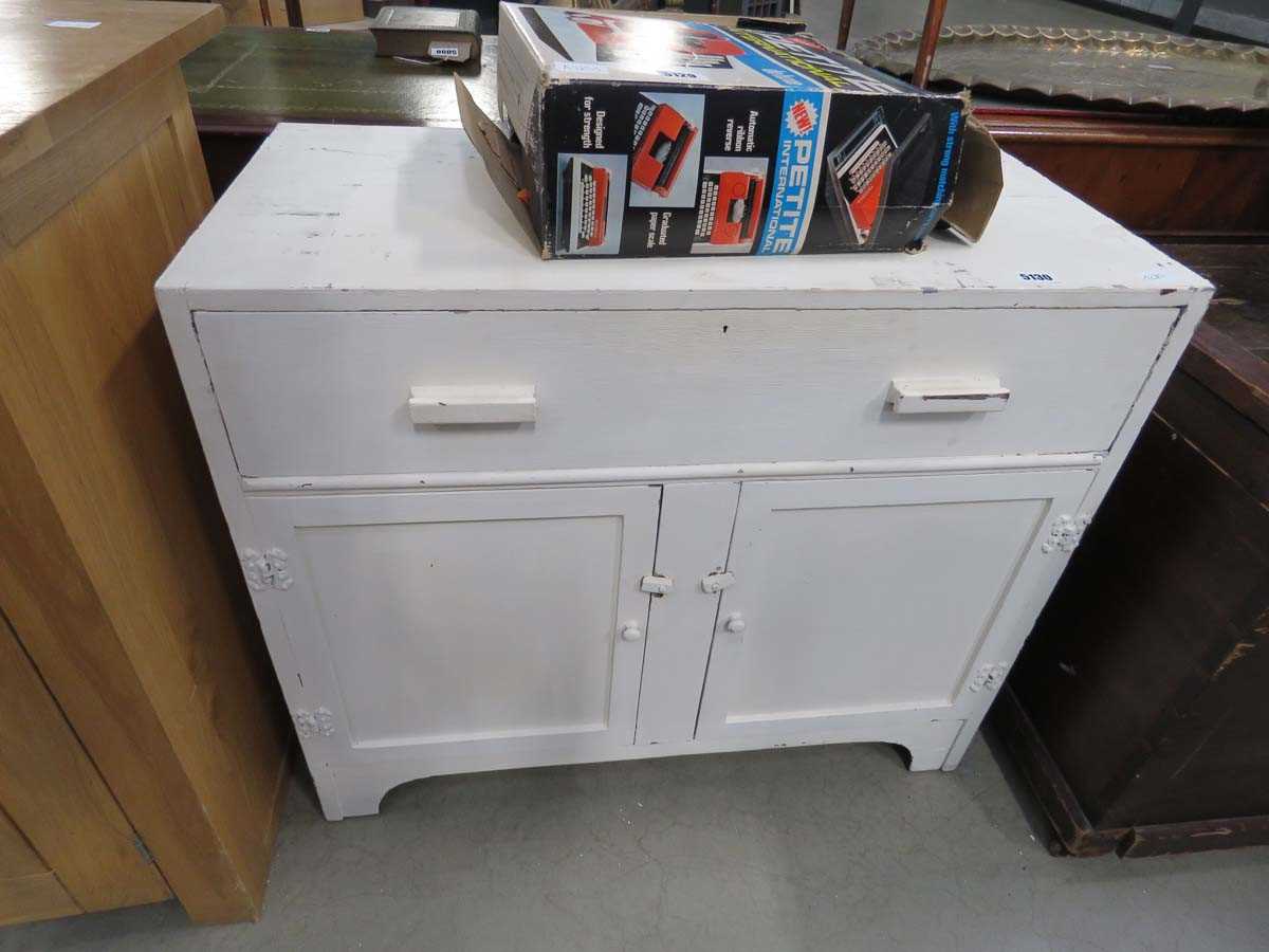 White painted double door cupboard with drawer over