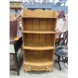 Bow fronted pine waterfall bookcase with drawer under