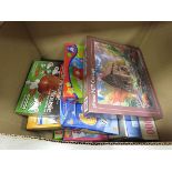 Box containing jigsaw puzzles and board games