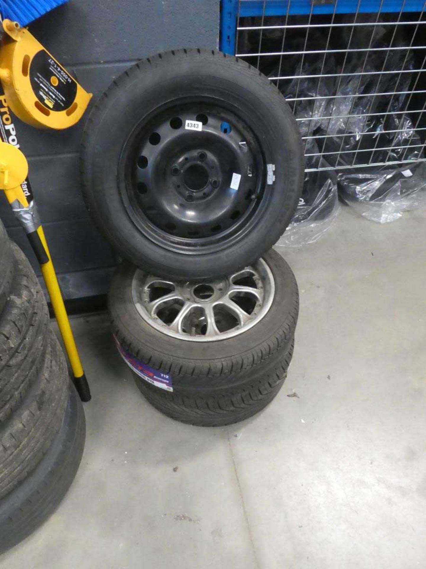 Two alloy wheels and tyres and a steel wheel