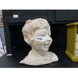 Plaster head and shoulder sculpture of a young girl