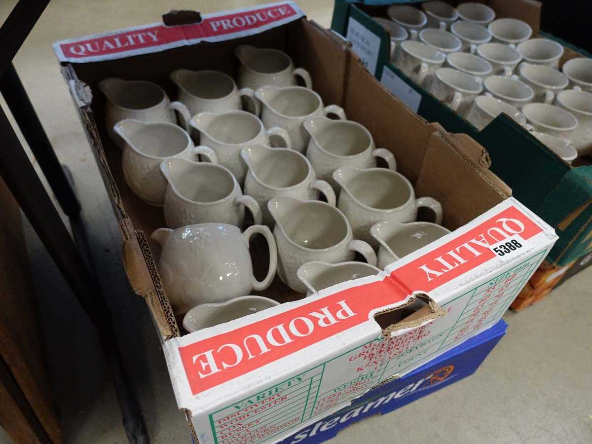 Two boxes containing Davenport milk jugs