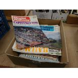 A box containing Railway World and Railway Modeller magazines.